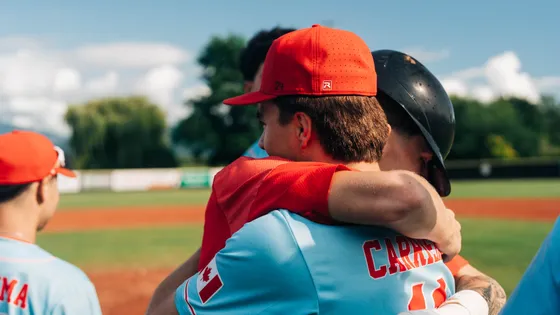 Two Abbotsford Cardinals players embrace after the win.